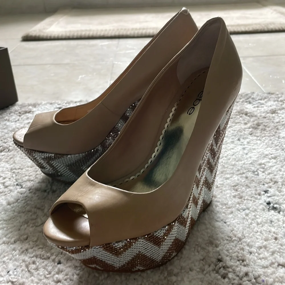 BEBE WEDGES! BRAND NEW!!! Metallic with Tan leather! Size: 6. Comes with Box!